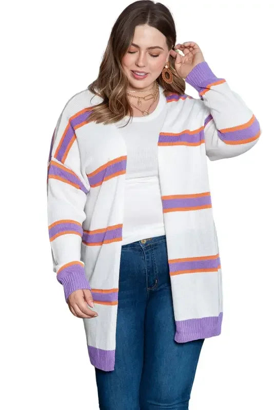 Woman wearing a multicolor striped cardigan, showcasing a stylish striped cardigan look