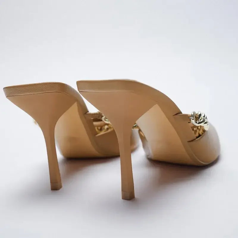 Beige pointed toe heels with gold chain detail, stylish high-heeled toe mules
