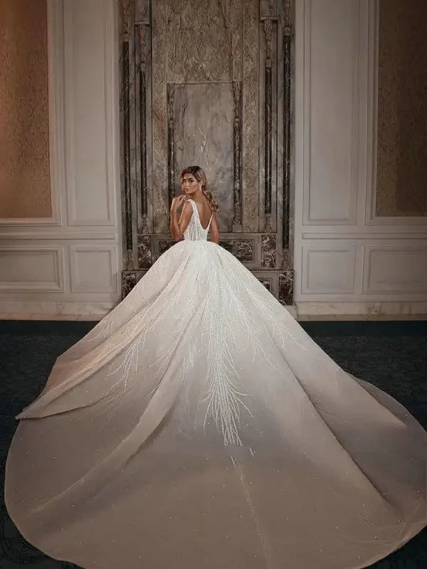 Elegant white sparkly wedding dress with detachable train for a stunning wedding look