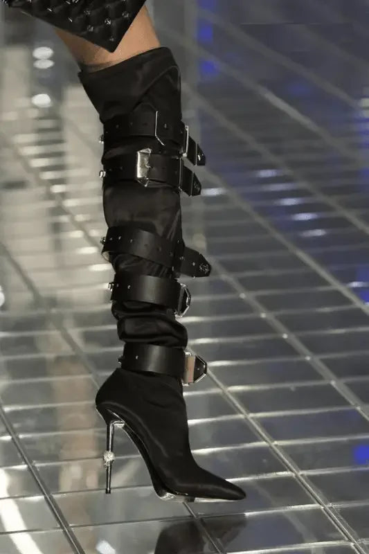 Black buckled high-heeled belt embellished runway boots for stylish fashion statements