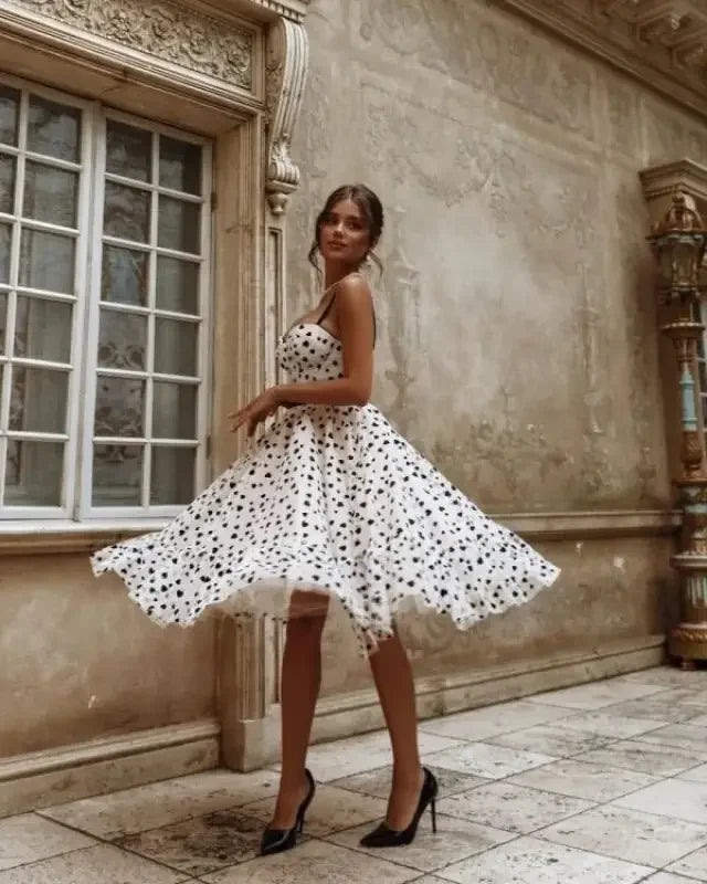 White polka dot dress in a heart shape prom dress style for elegant prom occasions