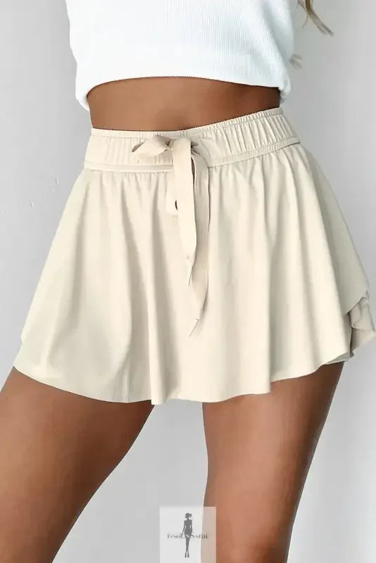 Beige drawstring high waist lined tennis skort with tie waist for active and casual wear