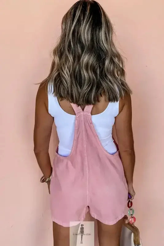 Pink denim romper with pockets featuring stylish pink denim short overalls