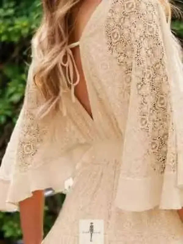 Lace cutout half sleeve mini dress in cream with intricate lace details and fashionable cutouts
