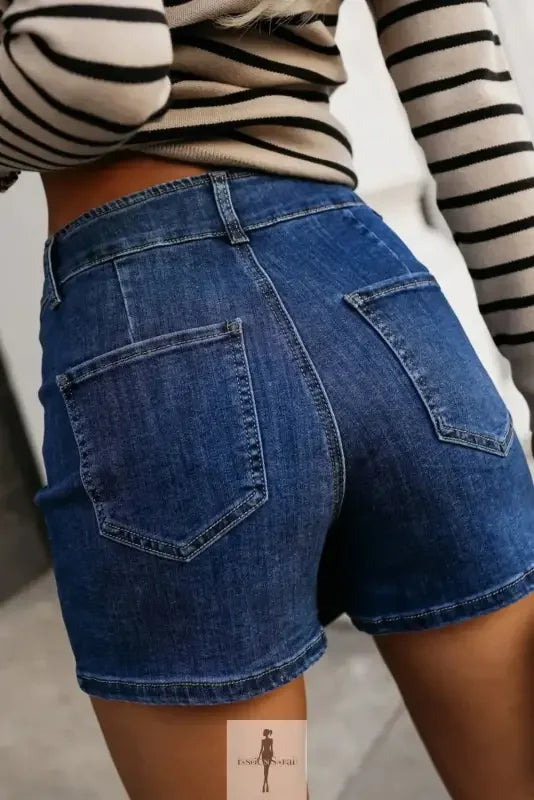 Blue denim shorts featuring asymmetric wrapped denim design for a trendy look