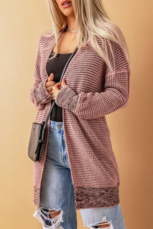 Pink knit pocketed duster cardigan by FashionSarah displayed in the product image