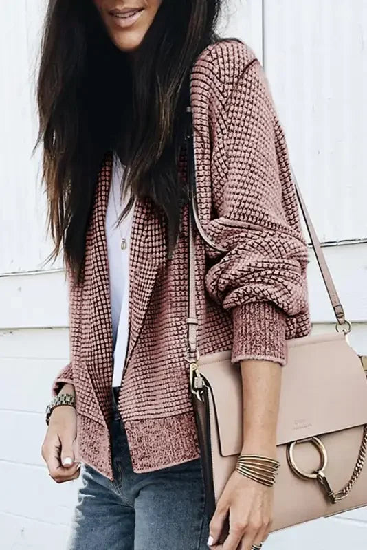 Pink patterned duster cardigan with knit pockets and beige handbag by Fashionsarah