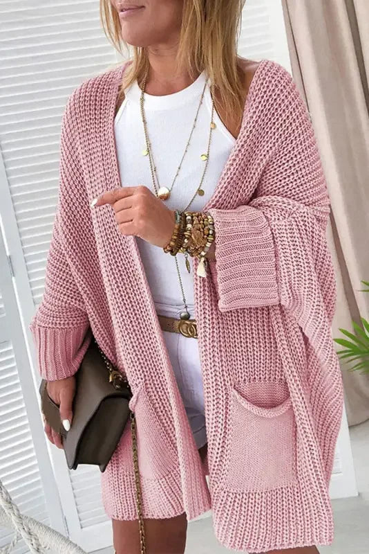 Pink oversized sweater cardigan from online boutique, perfect for cozy winter wear