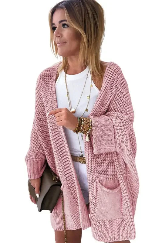 Pink oversized sweater cardigan from online boutique, perfect for cozy fashion
