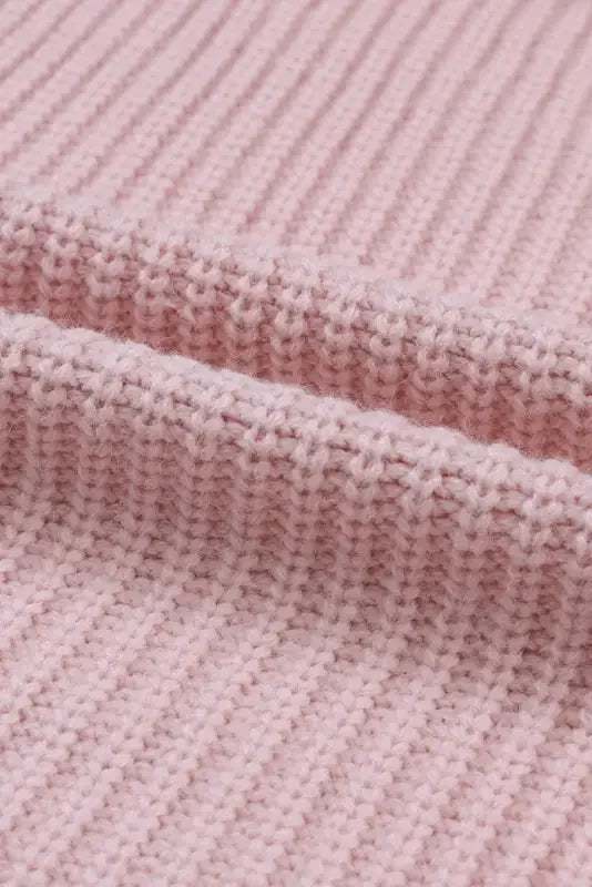 Pink oversized knitted fabric for a stylish sweater cardigan from an online boutique