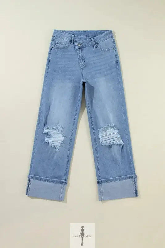 Blue high rise ripped jeans with a light wash and cuffed design for a casual look