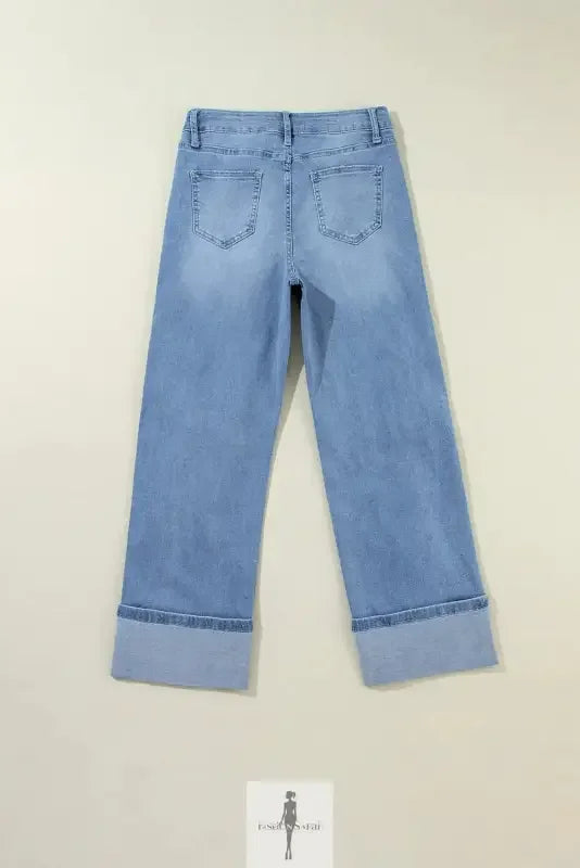 Light blue high rise ripped jeans with wide-leg and cuffed hems for a stylish look