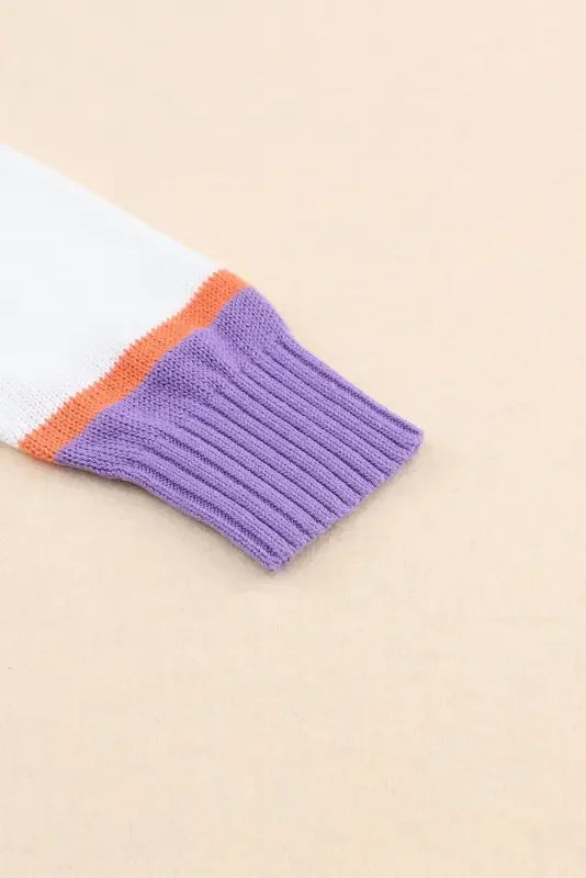 Knitted sleeve with colorful stripes from a multicolor striped cardigan for stylish warmth