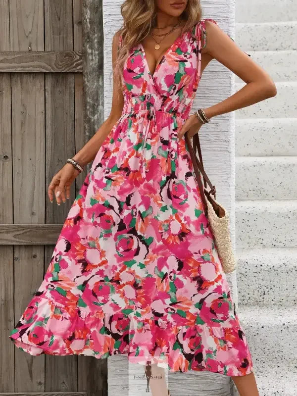 Floral print midi dress with ruffled smocked design, sleeveless style from online boutique