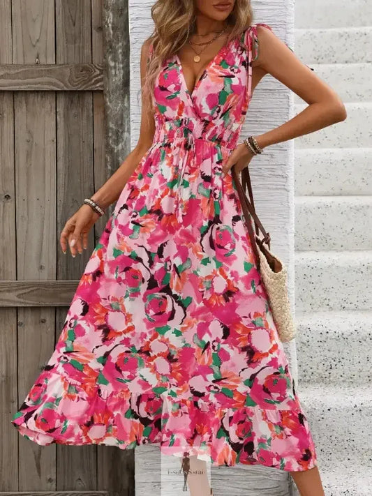 Floral print midi dress with ruffled smocked design, sleeveless style from online boutique