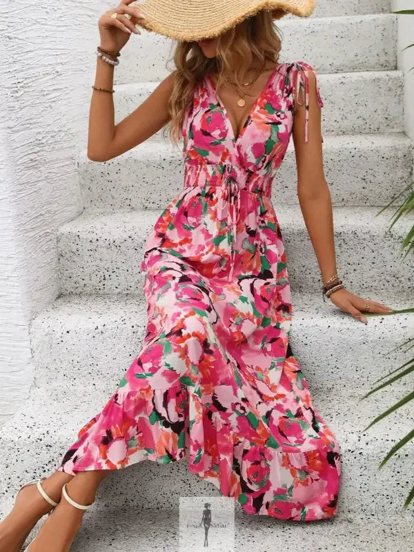Floral print maxi dress with ruffled smocked design, sleeveless style from online boutique
