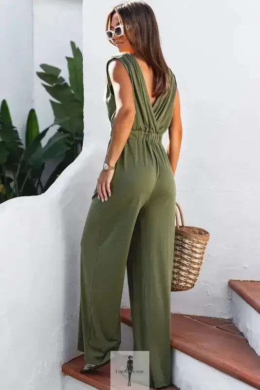 Olive green deep V wide leg jumpsuit showcasing stylish wide leg design and modern fit