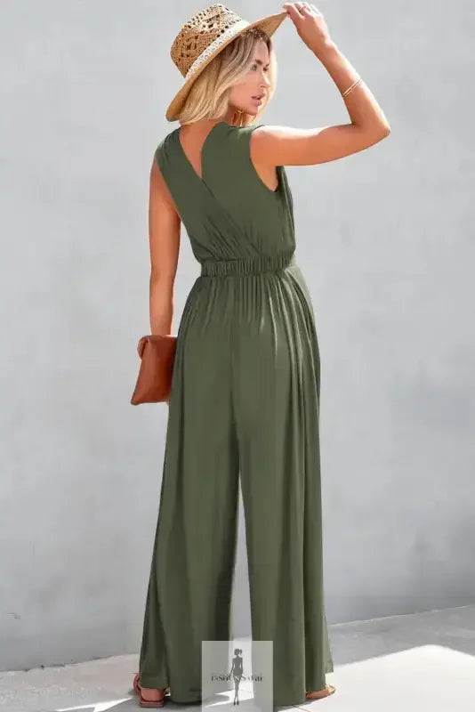 Olive green deep v wide leg jumpsuit with straw hat for stylish summer wear