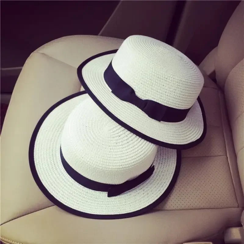 White straw boater hats with black ribbons, ideal beach sun hats and sun hats