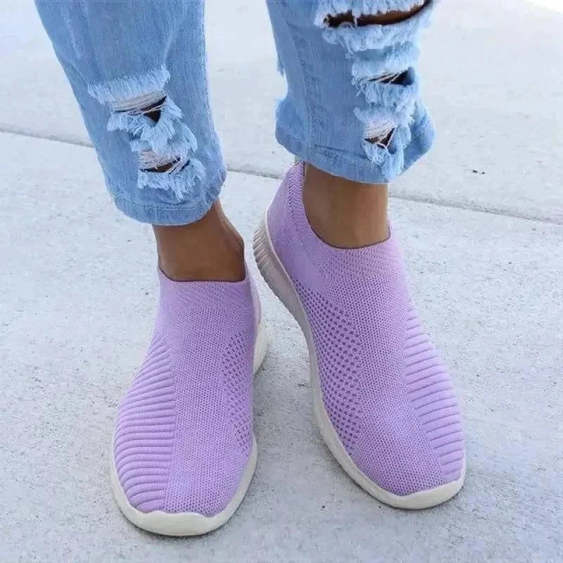 Women’s casual knit slip-on sneakers in lavender with stretch fabric upper and low heel
