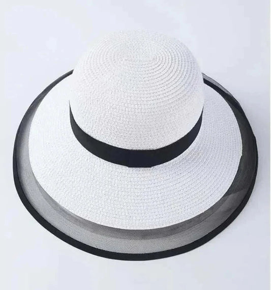 White summer sun hat for women with black trim and wide brim made of straw and nylon
