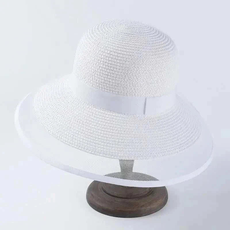 White casual women's summer sun hat made of straw with a 12cm brim and solid pattern
