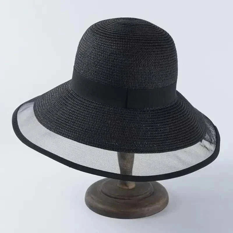 Black casual women's summer sun hat made of straw and nylon with wide brim and mesh edge