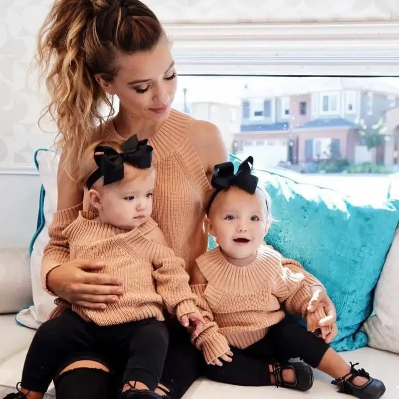 Matching mother and twin daughters wearing stylish mother daughter matching sweaters