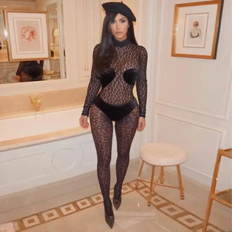 Kim Kardashian in a black beret and patterned bodysuit showcasing Kim’s Animal Sexy mesh jumpsuit fashionsarah
