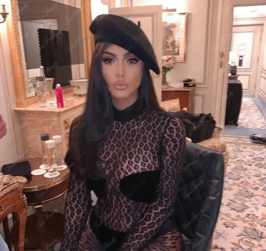 Woman in leopard print top and beret wearing Kim’s Animal Sexy Mesh Jumpsuit fashionsarah