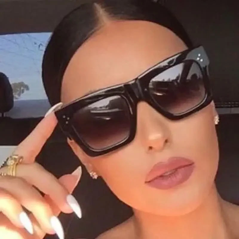 Black square sunglasses featuring a large square frame for stylish protection