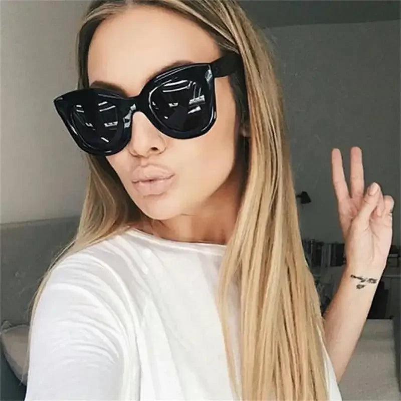 Oversized black sunglasses featuring cat sunglasses design for women’s fashion at an online boutique