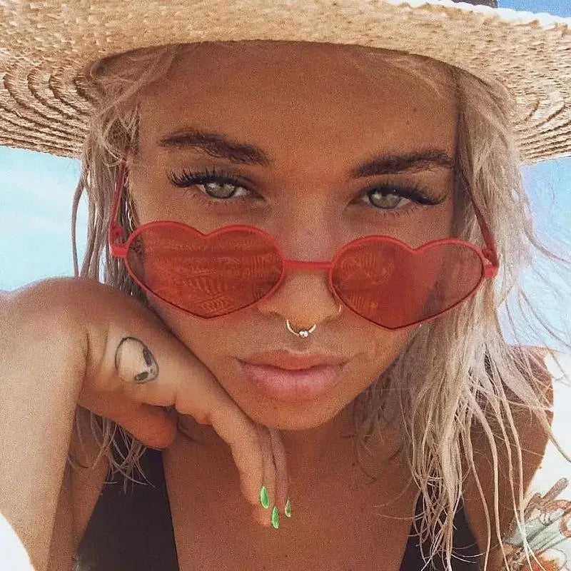 Heart-shaped red sunglasses from Heart Love Sunglasses collection worn by Blonde Woman