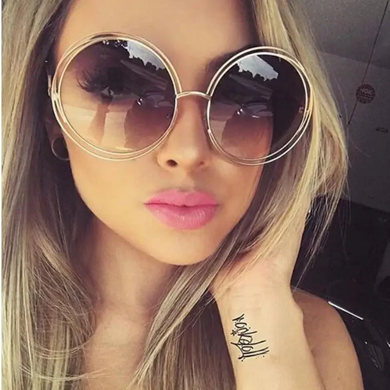 Luxury round sunglasses with double gold rims showcasing sophisticated style and elegance