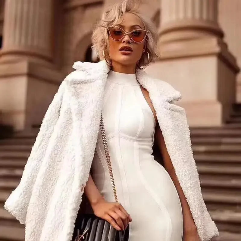 Stylish woman in white dress and coat wearing Silver Cat-Eye Sunglasses for online fashion shopping