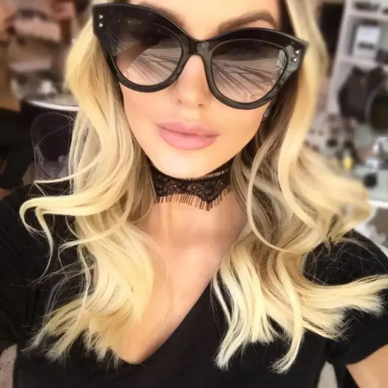 Blonde woman wearing Red Cat-Eye Sunglasses with vintage sunglasses style and lace choker