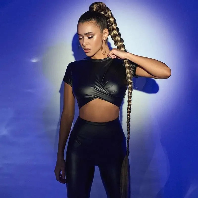 Woman wearing black women crossover crop faux leather outfit showcasing stylish crossover crop design