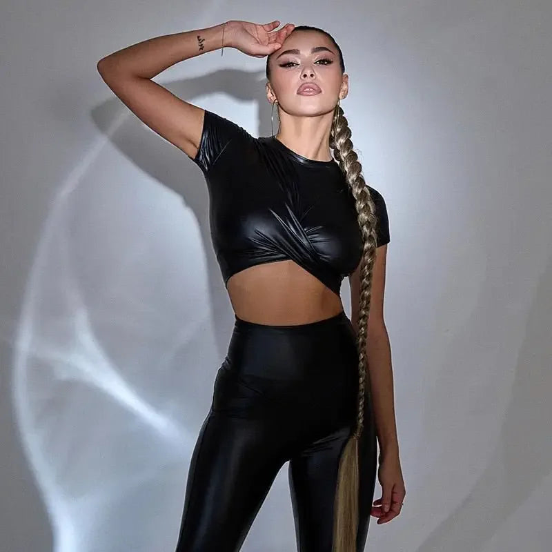 Woman in black women crossover crop faux leather outfit highlighting stylish crossover crop design