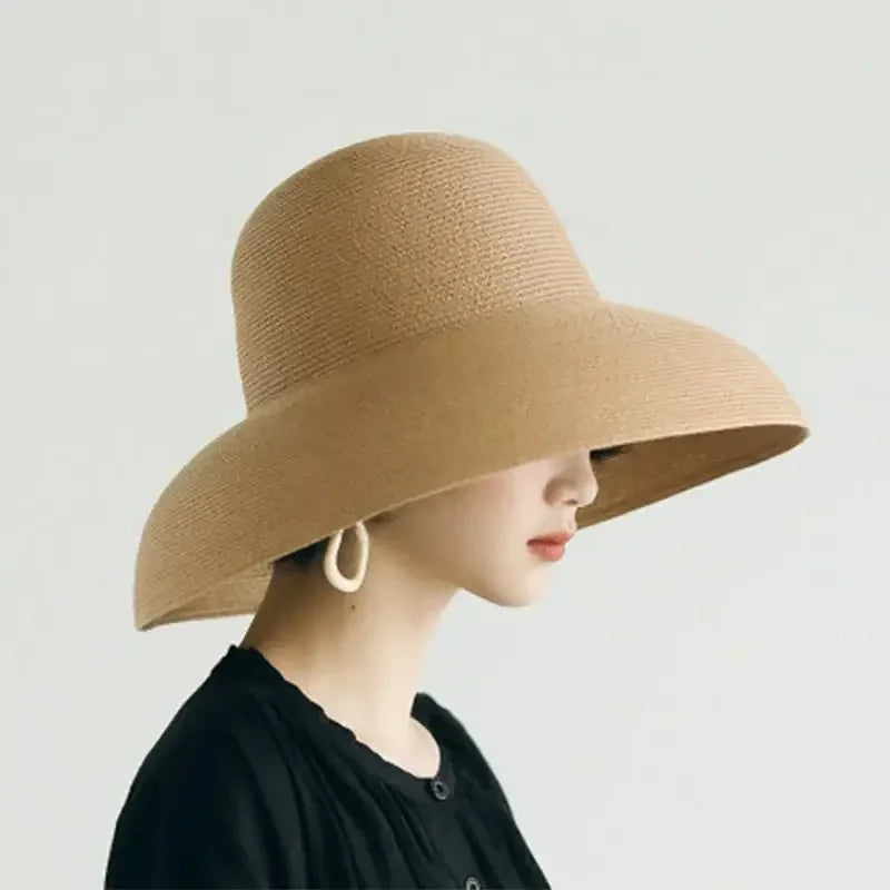 Elegant Ladies Straw Beach Hat with wide brim, perfect for summer and beach outings