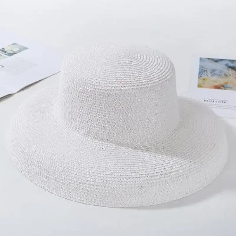 White woven sun hat displayed as Ladies Straw Beach Hat, perfect straw beach hat for summer