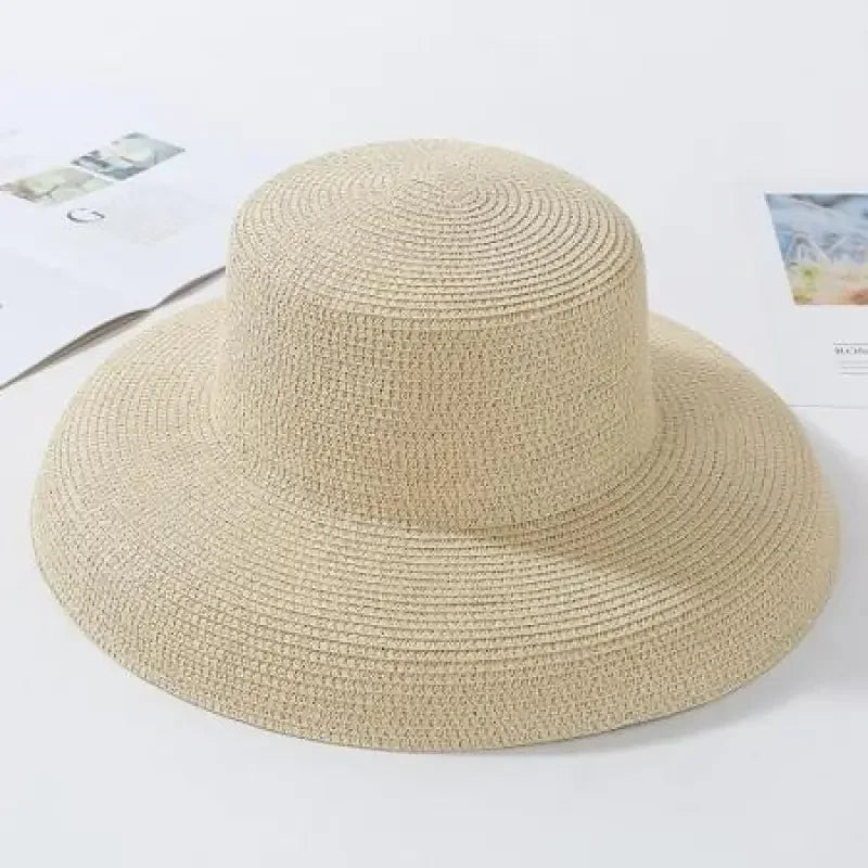 Beige woven ladies straw beach hat for stylish sun protection and beach outings