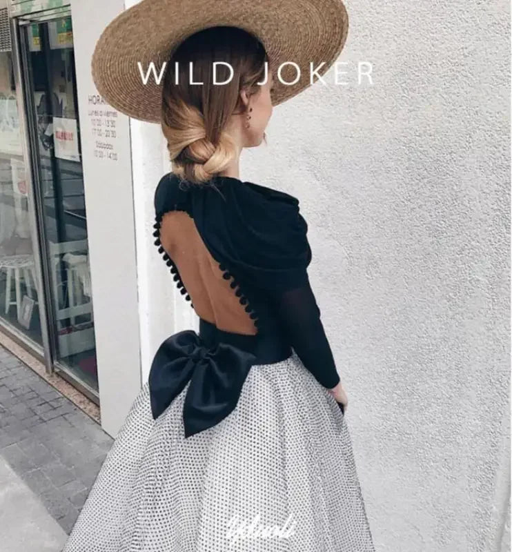Elegant backless dress with bow paired with wide brim straw hats for stylish summer look