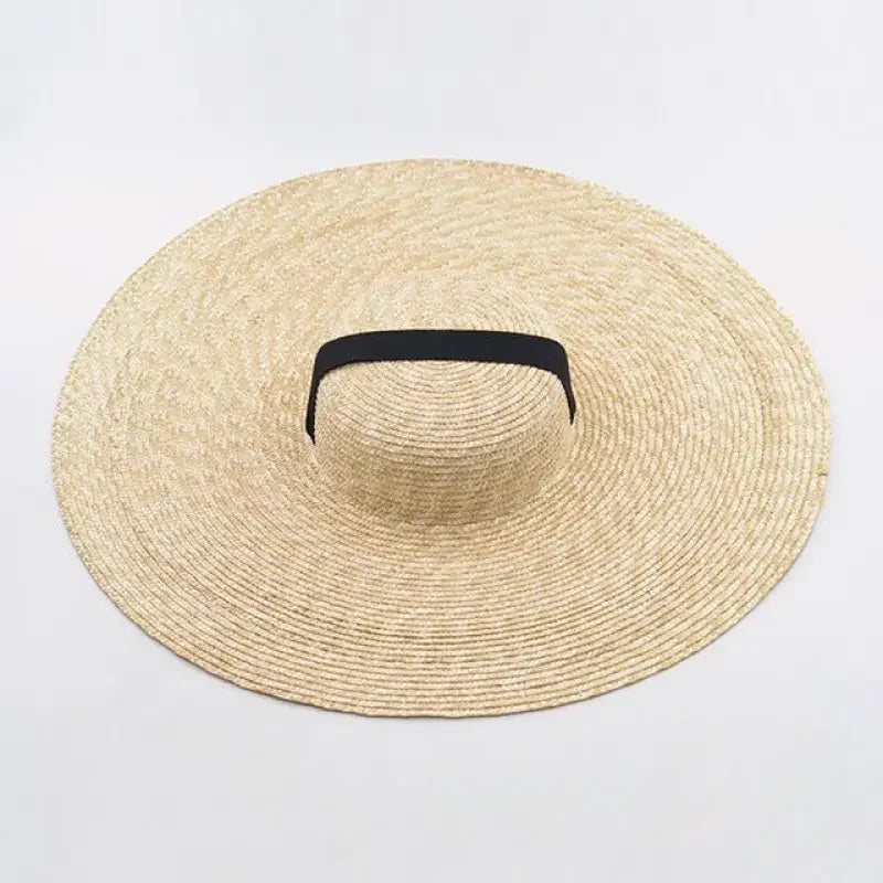 Wide brim straw hats with black band for stylish sun protection and summer fashion