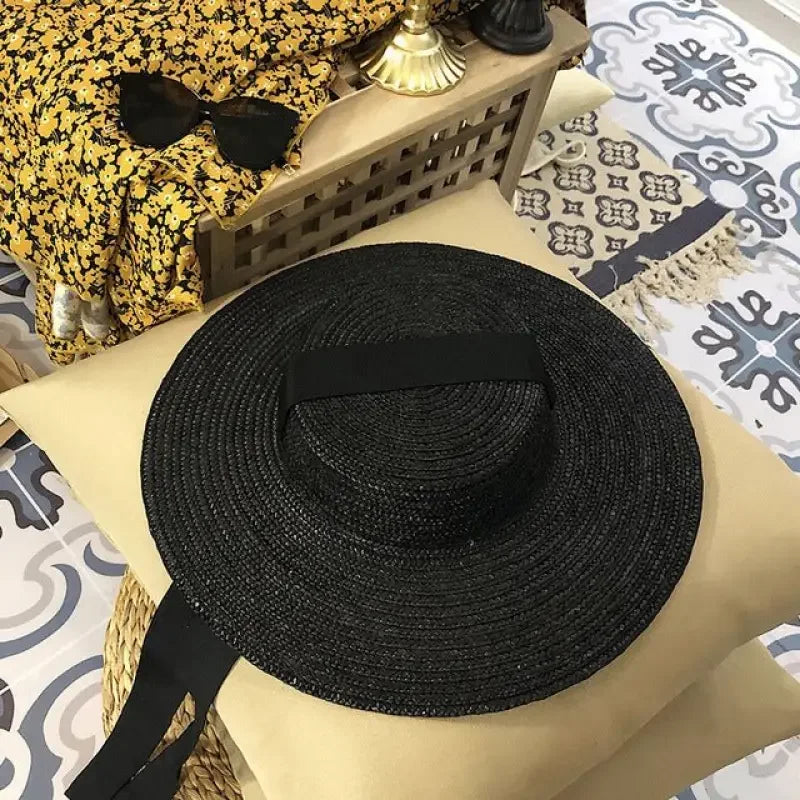 Black straw sun hat from Wide Brim Straw Hats collection with a fashionable wide brim