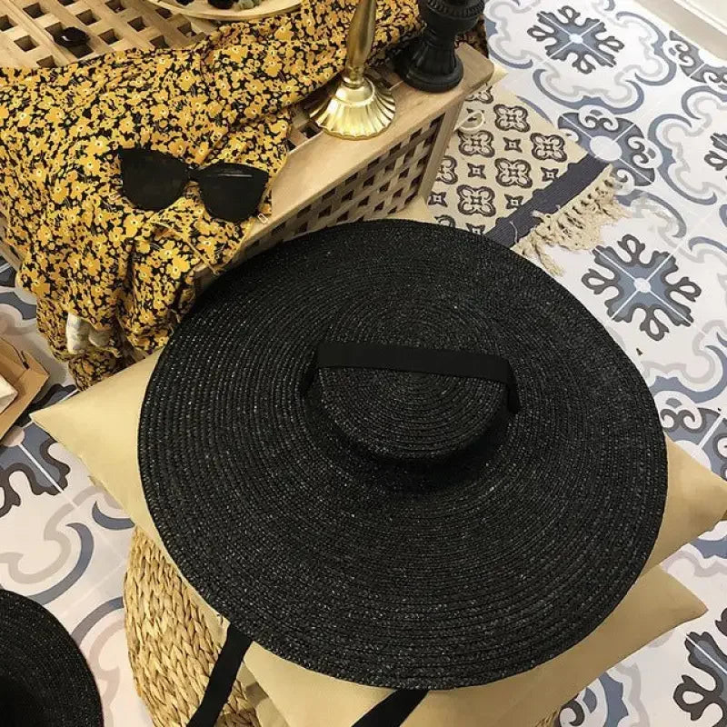 Black straw sunhat from wide brim straw hats collection featuring stylish brim straw hats