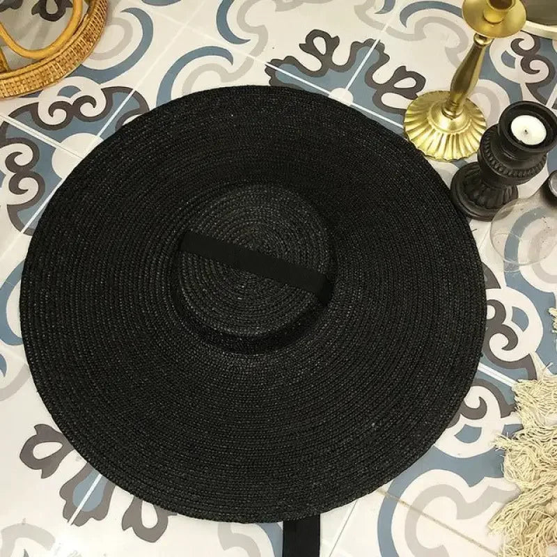 Black straw sun hat from Wide Brim Straw Hats collection showcasing wide brim straw design