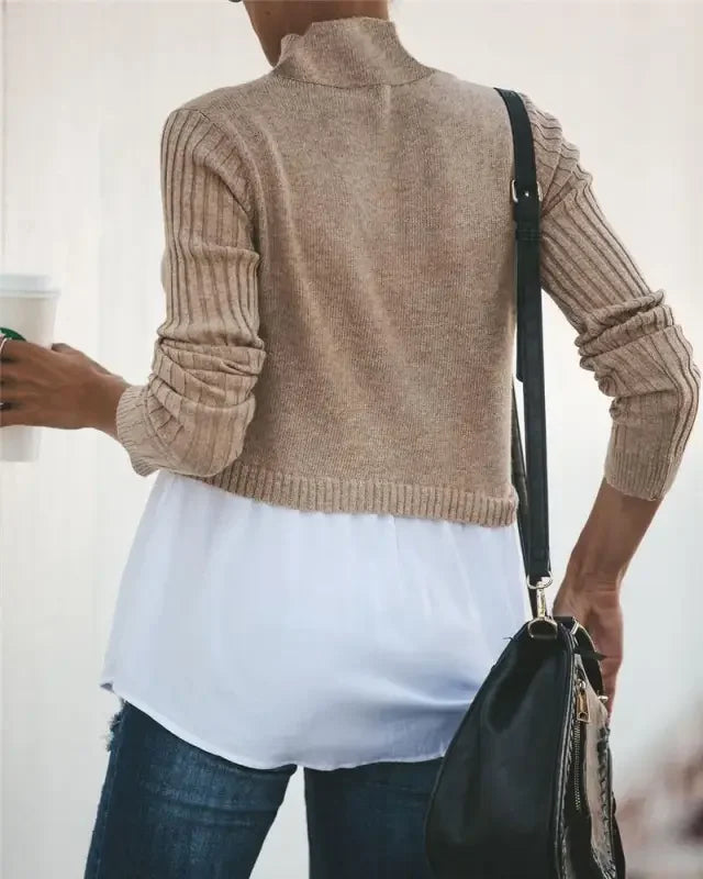 Tan ribbed knit sweater layered with a white blouse in chic layered knit sweater shirt style