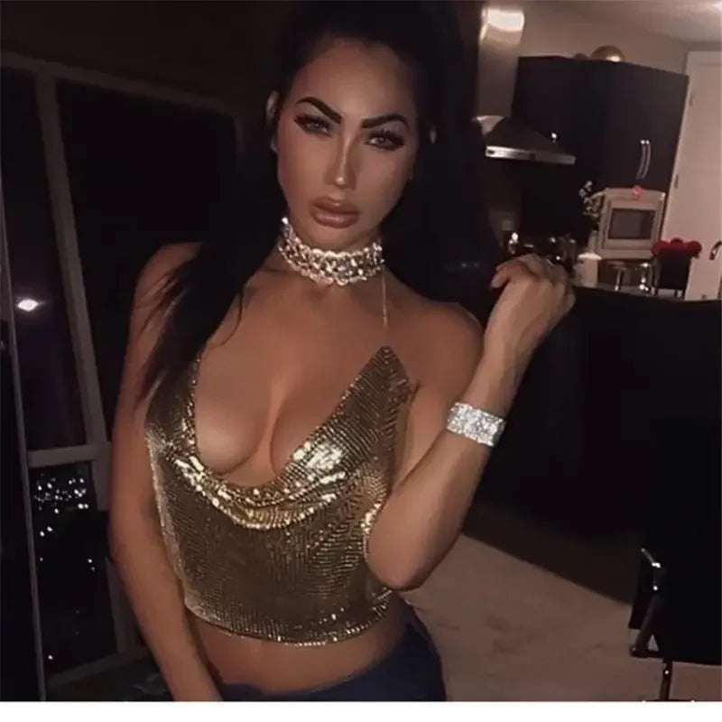 Woman wearing a shiny camis top in gold chainmail for stylish shiny camis tops display