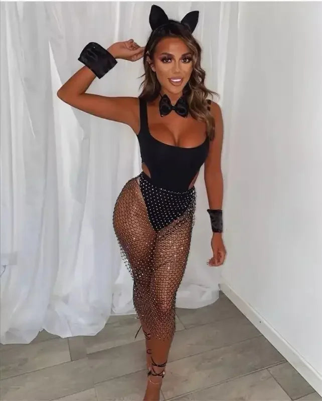 Woman in a black bunny costume with a rhinestone skirt from an online boutique women’s fashion collection