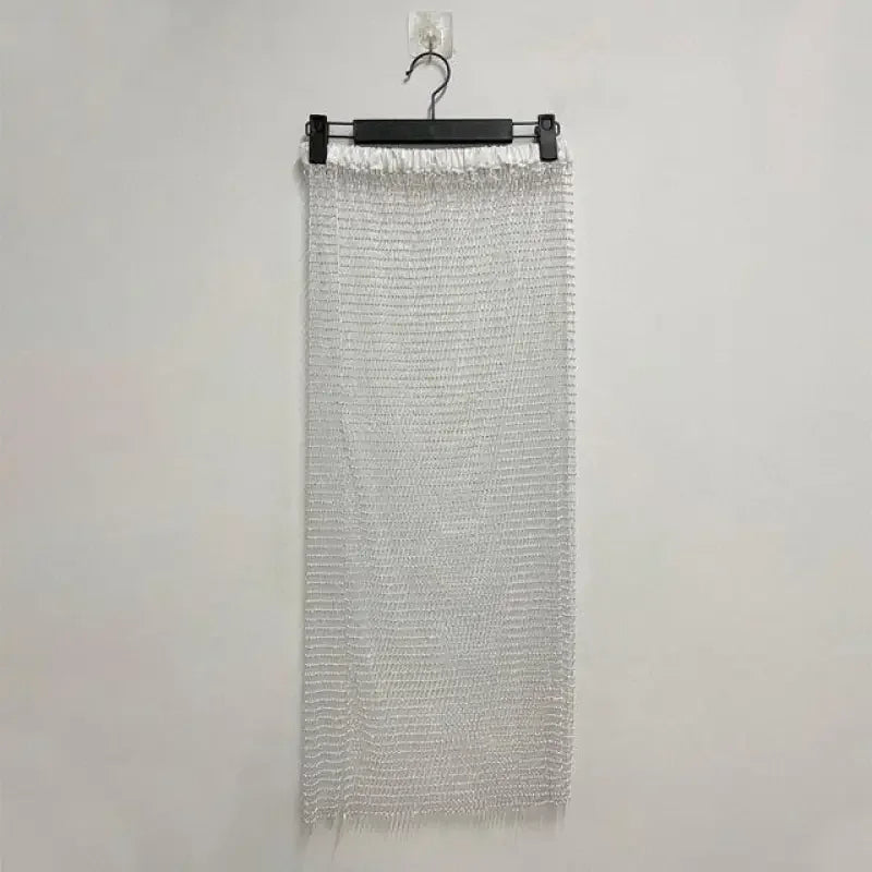 Silver chainmail skirt on hanger showcasing women’s fashion at online boutique rhinestone skirt